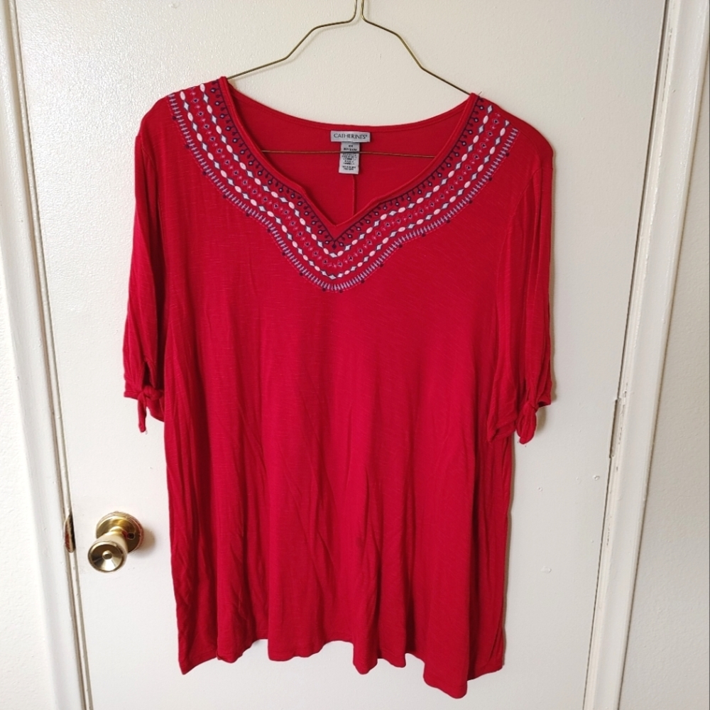 Catherine's red blouse with embroidered neckline